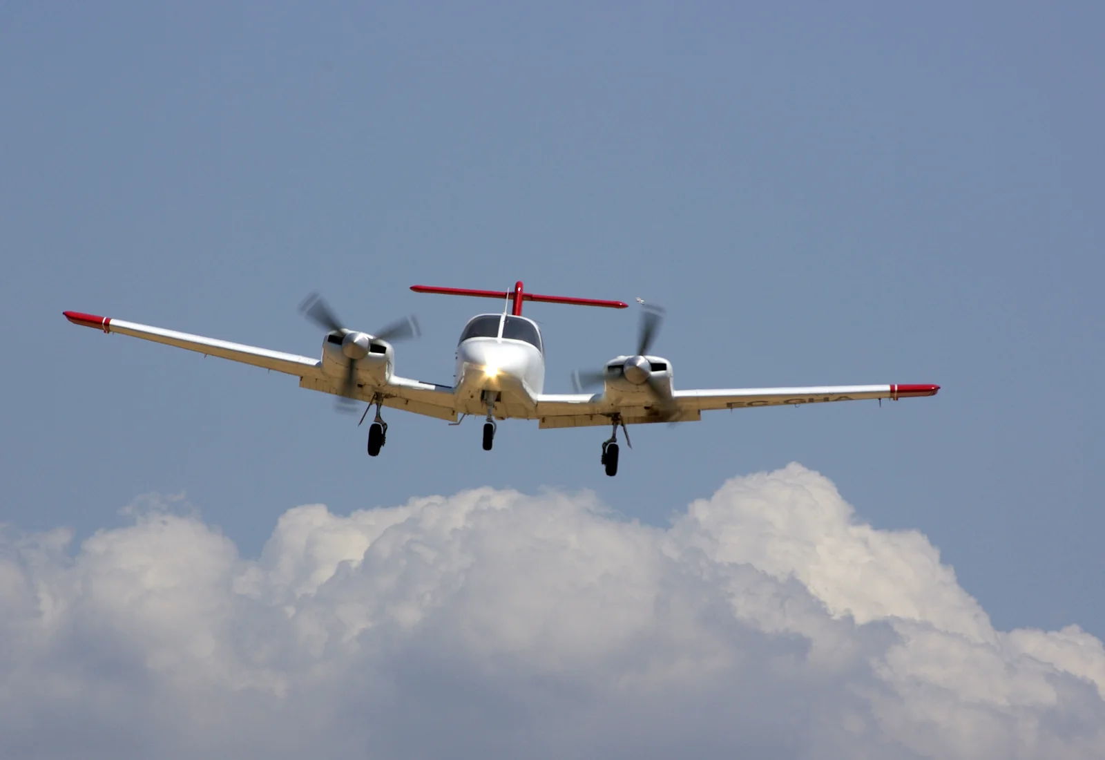 A Piper PA-44 Seminole in flight — the school’s multi-engine type